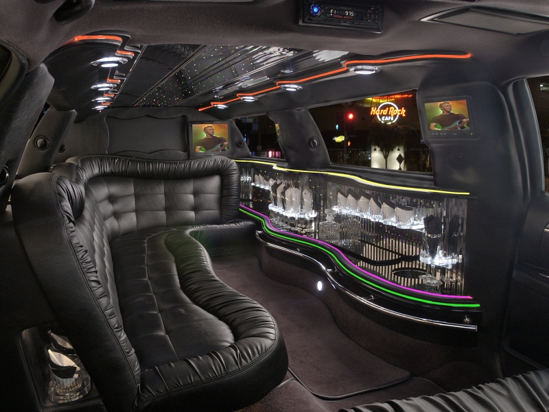 Limousine in downtown Houston at night
